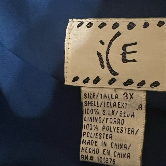 Ice Blue Silk Ruffled Blouse with V-Neckline and Bell Sleeves - Picture 4 of 5